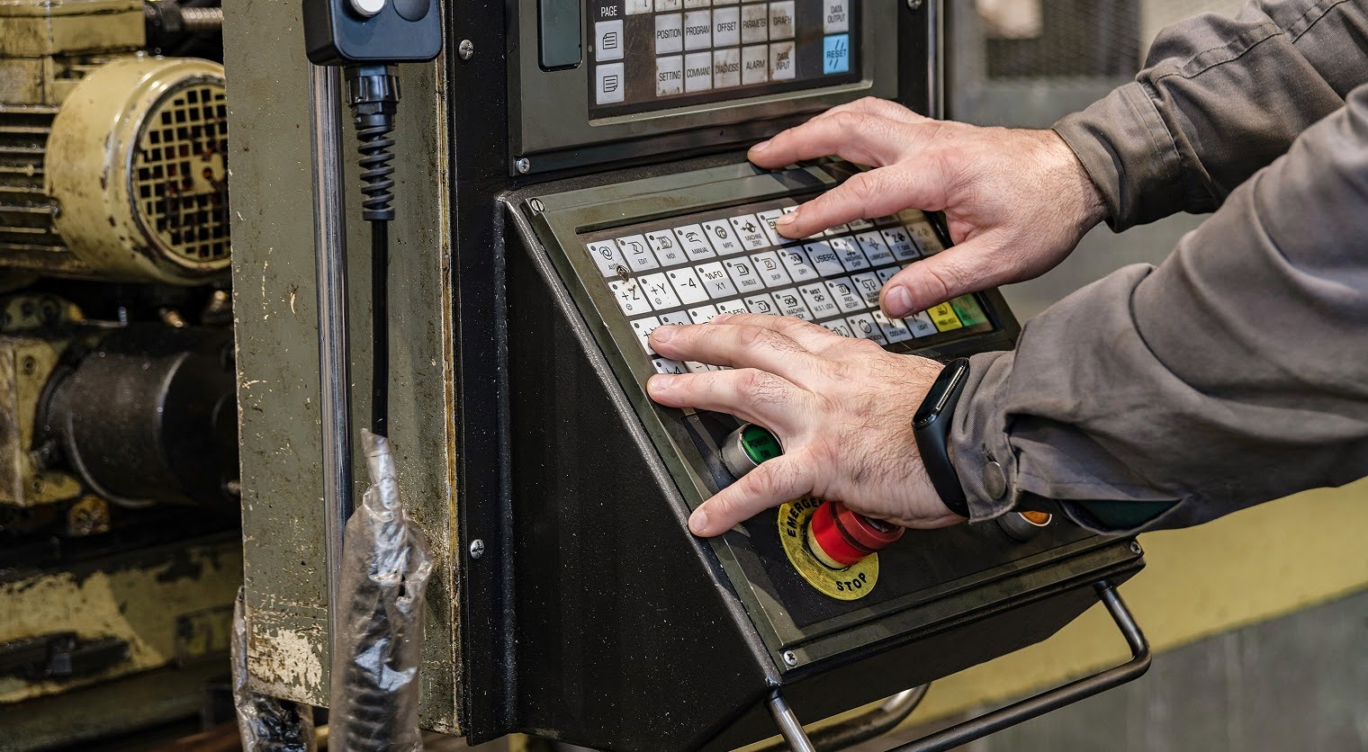 person controlling a cnc cutting machine